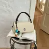 Bolsa de textura de alta qualidade feminina 2026 novo estilo moderna versátil bolsa transversal bolsa quadrada pequena de mão requintada bolsa pequena de mão para sair