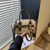 Bolsa Boston de mano estilo retro de comercio exterior para mujer, nuevo estilo, versión coreana, bolsa tipo almohada de nicho, bolsa diaria de un solo hombro cruzada, moderna