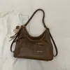 Bolsa de Ombro Texturizada Estilo Coreano Retro Popular da Moda deste Ano para o Trabalho Feminina 2025 Inverno Nova Bolsa Tote de Axila
