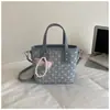 Bolso tipo cubo de lunares transfronterizo más vendido para mujer, nuevo bolso de moda versátil para el día a día 2026, bolso de hombro estilo coreano
