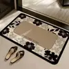 Alfombrilla de suelo floral de tierra de diatomeas de nuevo estilo en un estilo de lujo ligero, absorbe el agua y se seca rápidamente, felpudo antideslizante para entrada de baño