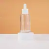 Suministrados directamente por el fabricante, frascos goteros redondos de vidrio de 30-100 ml para perfume, aceites esenciales, productos para el cuidado de la piel, frascos de aceites esenciales de tamaño de viaje