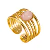 Estilo europeo y americano, anillo ligero de acero inoxidable de lujo para mujer, con un diseño bohemio de múltiples hilos, una piedra natural de forma ovalada y un acabado hecho a mano.