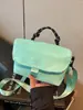 Bolsa de verão leve, versátil e de grande capacidade para meninas, modelo novo 2026, bolsa de tecido fashion color-blocking, bolsa de ombro e transversal