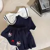 Conjunto de Dibujos Animados Hello Kitty Estilo Nuevo Universitario 2026 para Mujer, Conjunto de Dos Piezas de Falda Plisada de Verano, Tendencia Elegante y que Reduce la Edad