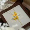 Collar Dorado con Borla Doble de Mariposa y Diseño Hueco de Filigrana, Adecuado para Uso Diario, Cadena Suave y Elegante para la Clavícula Venta al por Mayor