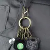 Llavero de Diseño de Nicho Anillo Colgante de Cintura Hebilla en S Elegante Simple Retro Hebilla en Forma de 8 Bronce Llavero de Metal Antirrobo