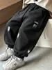 Ropa infantil pantalones para niños primavera y otoño 2026 nuevo estilo pantalones deportivos para niños pantalones de chándal casuales para niños pantalones largos para niños