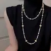 Elegante collar largo de perlas estilo coreano para mujer, versátil para otoño e invierno, exquisita cadena para suéter, colgante de letra simple y único, venta al por mayor
