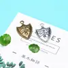 Accesorios para pulsera y collar de joyería NIANXING 30*20mm escudo de cruz de aleación