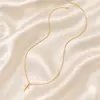 Collar con colgante de cruz con hebilla de semilla de melón, joyería transfronteriza europea y americana, collar de cadena larga y sencilla para mujer, cadena de suéter