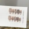 Puntas de uñas rosas hechas a mano de alta gama con un estilo suave, europeo y americano, con diseños de corazón, lazo y oso