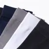 Calcetines de negocios para hombre a media pantorrilla, personalizados por el fabricante, algodón puro, diseño simple para primavera y otoño, resistentes al olor, absorbentes del sudor, calcetines de algodón transpirables, calcetines de color liso