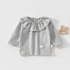 Top suave, con volantes y cuello redondo para niñas, con diseño de cara sonriente, hipoalergénico y elástico, adecuado para bebés y niños pequeños como una cómoda capa base para usar en casa.