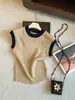 Top de punto calado con bloques de color estilo coreano y manga acampanada para mujer, nuevo top casual versátil de verano 2026