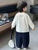 Camiseta de manga larga estampada para niños, primavera y otoño, estilo coreano, diseño de bloques de color, top casual para niños pequeños y niños, calidad de exportación
