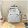 Mochila feminina com padrão de estrelas listradas, adequada para estudantes do ensino médio, para a escola, deslocamento e viagens casuais