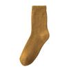 Calcetines de tubo otoño e invierno color liso calcetines de rizo forrados de felpa gruesos invierno hombres y mujeres calcetines de toalla cálidos de lana estirada fabricantes