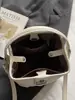 Bolso tipo cubo nuevo para principios de otoño de 2026, bolso cruzado de hombro elegante de color liso, único y a la moda, bolso de mano de alto valor estético