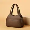 Bolso Estilo Coreano 2026 Nueva Moda Verano Bolso Cesta de Mano Bolso Cubo de Cuero Suave Simple de Hombro Único para Mujer