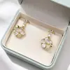 Pendientes de Flor con Goteo de Aceite de Gama Alta, Frescos y Elegantes, con Exquisitos Incrustaciones de Diamante en Oro y Plata, Clips para Orejas sin Perforar para Mujeres