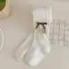 2023 primavera e outono novas meias-calças infantis cor sólida padrão de cânhamo flor pequena leggings fofas para meninas atacado