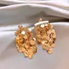 Pendientes de borla redonda con lentejuelas plateadas para mujer, pendientes de moda transfronteriza, sensación de lujo ligero, pendientes de nuevo temperamento, venta al por mayor
