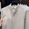 Camisa de Hombre 100% Algodón Puro Primavera y Otoño Nuevo Textil Oxford Lavado Rayas Verticales Top Casual Camisa de Manga Larga para Hombre