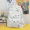 Mochila para estudiantes de preparatoria y universidad con graffiti transfronterizo, mochila versátil de nicho con estampado de estrellas, mochila de gran capacidad para mujer