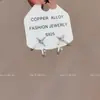 2025 Nuevos Pendientes Simples de Cuatro Puntas de Estrella Moda Nicho Viento Frío Dulce Fresco Pendientes de Estrella Colgantes Traseros Mujeres Ins