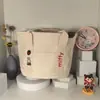 Bolsa de Mão Estilo Japonês Ins Fofa Bordada em Lona para Mulheres, Novo Modelo para Mães, Bolsa Tote Portátil para Sair, Lancheira para o Trabalho