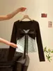 Conjunto dulce de dos piezas estilo coreano para mujer, camiseta corta de lunares con pajarita, top de manga larga ajustado, otoño 2026