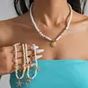 Colar de Estrela do Mar com Contas de Vidro, Concha e Pérolas Estilo Resort Europeu e Americano, Corrente de Clavícula de Luxo Leve de Alta Qualidade, Acessório de Pescoço Moderno para Mulheres