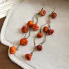 Pendientes de borla con carcasa de madera marrón transfronterizos europeos y americanos, pendientes de estilo vintage Maillard, pendientes de mujer de lujo ligero de alta gama
