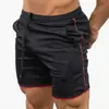 Amazon shorts de verão masculinos de secagem rápida cor sólida esportivos fitness calças de cinco pontos calças de praia fabricantes atacado