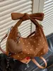 Bolsa de mão com poá de design de nicho transfronteiriço para mulheres, nova bolsa estilo bolinho elegante para o dia a dia 2026, bolsa de ombro transversal retrô