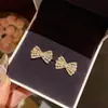 Pendientes de Lazo Dulces y Elegantes Estilo Coreano para Mujer, Lujo Ligero Nicho Exquisitos con Circonita Microincrustada Perla Pendientes de Botón Venta al por Mayor