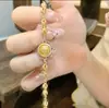 Almofariz VajraDeus Amarelo da RiquezaPalavras AuspiciosasEsmalte Ouro Pulseira para MulheresLuz Luxo Nicho Design de Ponta Pulseira para Mulheres