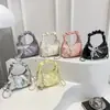 Bolso de Mano Pequeño Plateado Plegado para Mujer Verano 2025 Nuevo Bolso Dumpling Dulce Tira Colgante Bolso Cruzado para el Trabajo Moderno