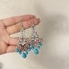 Pendientes colgantes de piedra de pino de estilo nacional retro bohemio europeo y americano transfronterizos, pendientes con borlas huecas, venta directa de fábrica