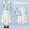 Nova coleção de primavera e outono estilo coreano: moletom préppy com gola azul-marinho e saia doce e fofa com gravata borboleta, um conjunto de duas peças para meninas