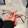 Gafas de media montura para cejas 2025 nuevas anti luz azul miopía graduadas montura de metal de alta moda caja de gafas para mujer