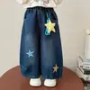 Nova Coleção de Outono: Calça Jeans Infantil Estrela Cortante 2026 Versão Coreana Calça Wide Leg para Meninas Roupa Infantil Atacado