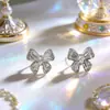 Pendientes de botón Exquisitos de Moda de Primavera de Lujo Ligero de Gama Alta con Mariposa y Circonita para Mujer, Pendientes Versátiles de Nicho Simples Elegantes