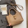 Popular Transfronterizo Simple Patrón de Lichi Multitud Pequeña Viajero Bolso Cubo Portátil para Mujer Casual Color Sólido Todo-fósforo Bolso Cruzado