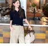 Camisa casual elegante de punto de lana cachemir hilo Xiao E Yuan, polo de punto de manga corta acanalado vertical para mujer