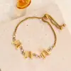 Venta al por mayor transfronteriza de pulseras de acero de titanio con cremallera de mariposa tridimensionales, versátiles y elegantes, de diseño europeo y americano