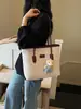Bolsa de Ombro Feminina Transfronteiriça de Verão Grande Capacidade 2026 Nova Moda Bloqueio de Cores Embossada Bolsa Tote para Estudante Festa Comutador