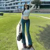 Jeans acampanados versátiles de tiro bajo elástico ajustados de corte recto retro para mujer 2026, pantalones largos de longitud extendida y tiro bajo para un look de cadera más lleno