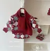 Conjunto de Otoño e Invierno para Niñas 2025 Nuevo Estilo Cuadros Rojos Cuello en V Tejido Suave Grueso Suéter y Falda Conjunto de Dos Piezas